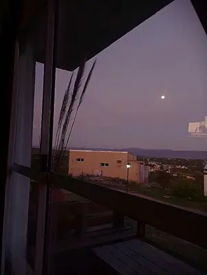 a view of a building from the window of a room at Cabaña La Abuela Chicha - Tanti in Tanti