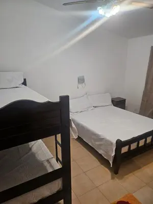a bedroom with two bunk beds in a room at Cabañas Kay Pacha in San Antonio de Arredondo