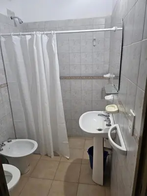 a bathroom with a sink and a toilet and a mirror at Cabañas Kay Pacha in San Antonio de Arredondo