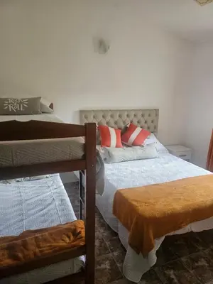 a bedroom with two bunk beds in it at Cabañas Kay Pacha in San Antonio de Arredondo