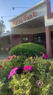 a building with flowers in front of it at Hotel Tanti Spa & Resort in Tanti