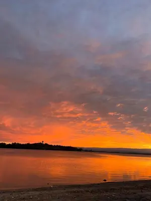 a sunset over a body of water at Departamentos La Morita in Embalse