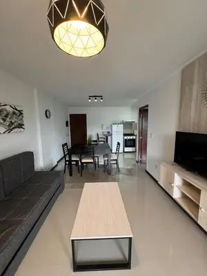 a living room with a couch and a table at Complejo Venetto Village in Villa Parque Siquiman