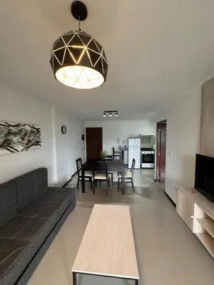 a living room with a couch and a table at Complejo Venetto Village in Villa Parque Siquiman