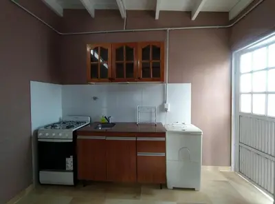 a kitchen with a stove and a sink at Rio Segundo Colo 5 in Río Segundo