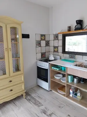 a kitchen with a stove and a counter top at LA VALENTINA casa de campo in Villa Cura Brochero