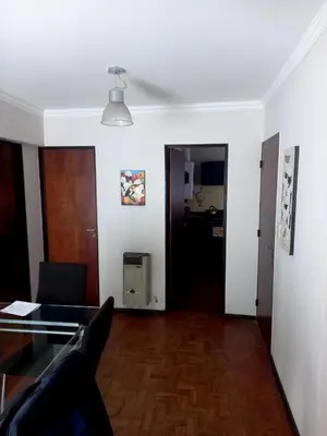 a living room with a couch and a glass table at Balcon2k in Cordoba