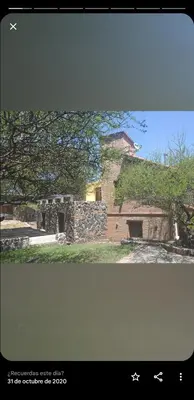 a picture of a stone building with a tree at Lagriega in Cuesta Blanca