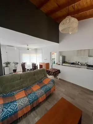 a living room with a couch and a kitchen at 