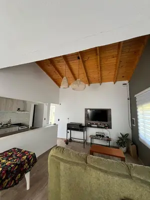 a living room with a couch and a piano at 