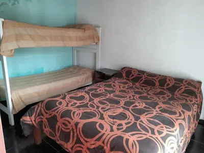 a bedroom with two bunk beds in a room at Mateo y Stella in Bialet Massé