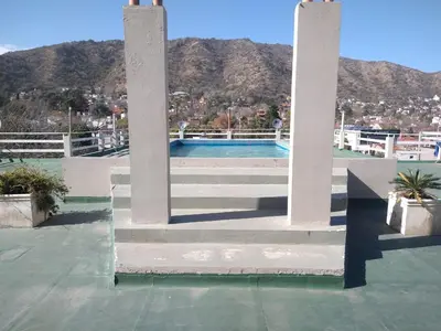 a view of a pool from the roof of a house at Deptos Carlos Paz A in Villa Carlos Paz