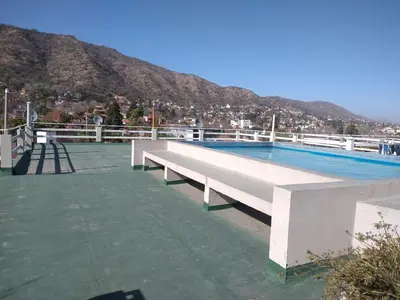 a large swimming pool on top of a building at Deptos Carlos Paz A in Villa Carlos Paz