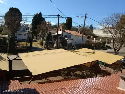 a large yellow tarp on top of a roof at Departamento en la Villa in Villa Carlos Paz