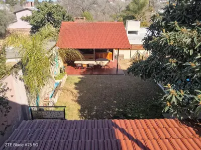 an aerial view of a house with a red roof at Departamento en la Villa in Villa Carlos Paz