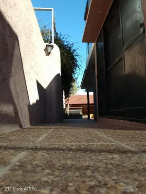 a shadow of a door on a building at Departamento en la Villa in Villa Carlos Paz