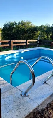 a swimming pool with a curved rail around it at Mateo y Stella 2 in Bialet Massé