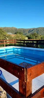 a pool with a blue top on top of a deck at Mateo y Stella 2 in Bialet Massé