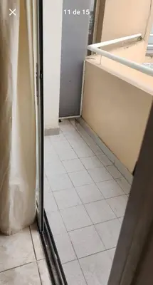a room with a refrigerator and a tile floor at La Terraza in Cordoba