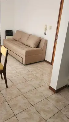 a couch and a chair in a living room at La Terraza in Cordoba
