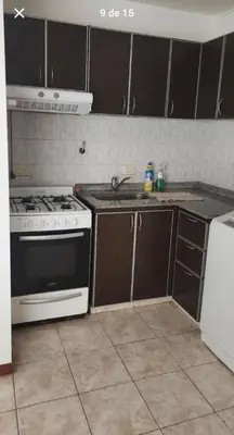 a kitchen with a stove and a sink at La Terraza in Cordoba