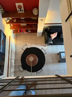 an overhead view of a living room with a table and chairs at Departamento con Balcón y Asador in Río Cuarto