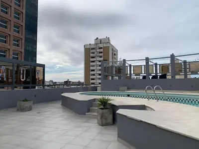 a swimming pool on the roof of a building at Espectacular departamento en el centro 301 in Cordoba