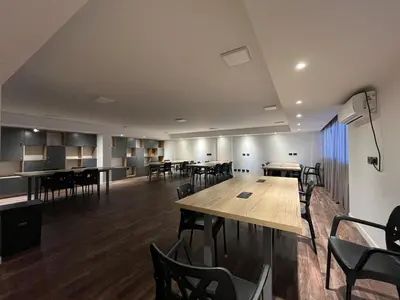 a large room with tables and chairs in it at Espectacular departamento en el centro 301 in Cordoba