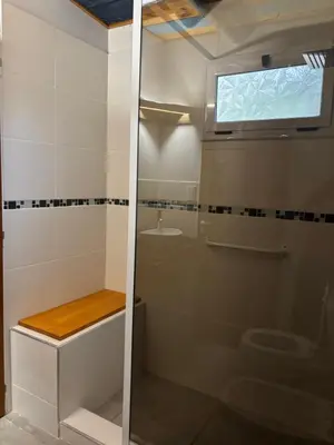 a bathroom with a shower and a toilet at Rio Dorado Resort in Cavalango