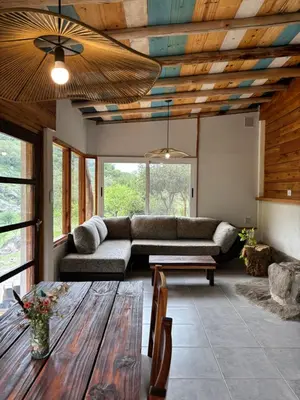 a living room with a couch and a table at Rio Dorado Resort in Cavalango