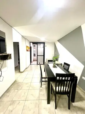a dining room with a table and chairs at Rincon de Alta Cordoba in Cordoba