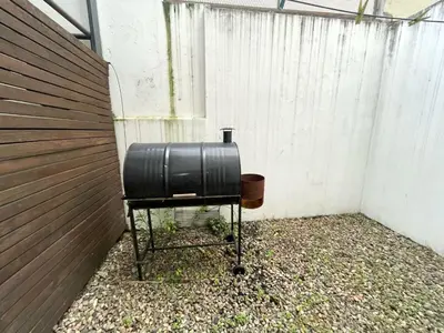 a black suitcase sitting on a chair next to a fence at Rincon de Alta Cordoba in Cordoba