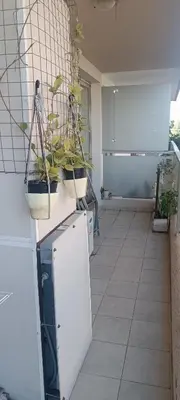 a kitchen with potted plants on top of a refrigerator at Dpto Nueva Cordoba frente Palacio Ferreyra a 100mt Consulado España in Cordoba