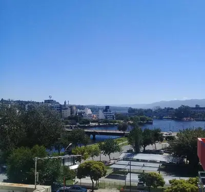 a view of a city with a body of water at Departamento Monoambiente Centro Villa Carlos Paz in Villa Carlos Paz