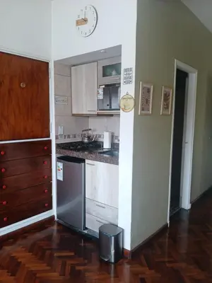 a kitchen with a sink and a stove top oven at Departamento Monoambiente Centro Villa Carlos Paz in Villa Carlos Paz