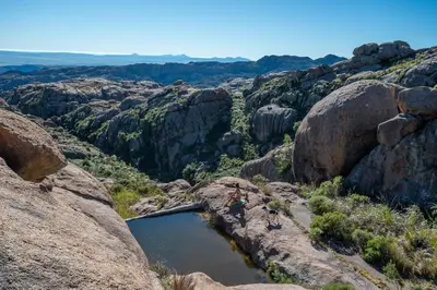 a pool of water in the middle of a canyon at Rustic Mountain Shelter Pure Nature in Las Rabonas