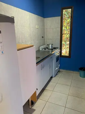 a kitchen with a stove and a sink in it at Don Valerio in Mina Clavero