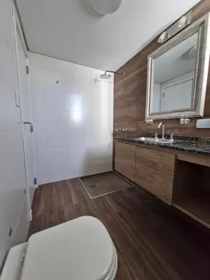 a bathroom with a toilet and a sink at Bonito departamento in Cordoba