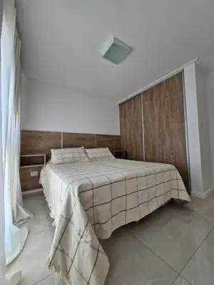 a bedroom with a large bed in a room at Bonito departamento in Cordoba