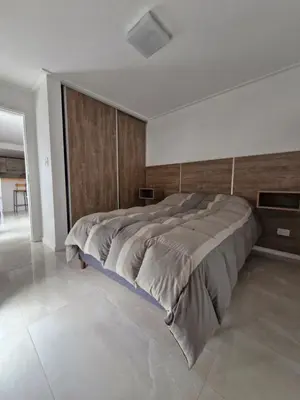 a bedroom with a large bed in a room at Agradable departamento in Cordoba
