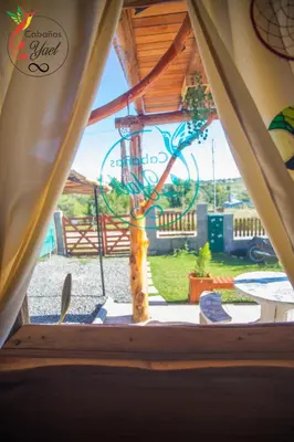 a view through a window of a tent at Cabaña Yael in Villa Parque Siquiman