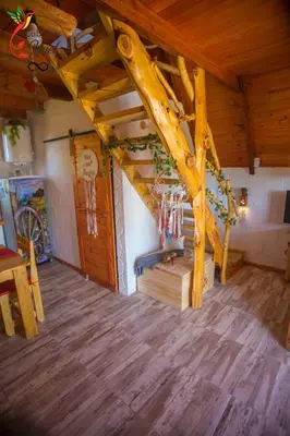 a room with a wooden vaulted ceiling with wooden floors at Cabaña Yael in Villa Parque Siquiman