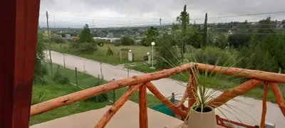 a view of a road from a balcony with a plant at Cabaña Yael in Villa Parque Siquiman