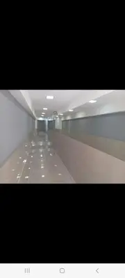 a long hallway with mirrors in a building at Derpa zion in Cordoba