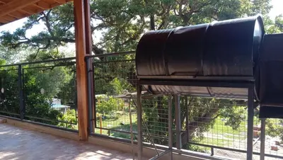 a large screened in porch with a large window at Tierra Mia in Carpintería