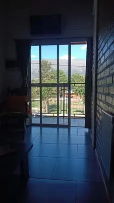 a room with a large glass door with a view at Tierra Mia in Carpintería
