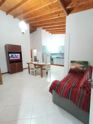 a living room with a bed and a dining room at Tierra Mia II in Carpintería