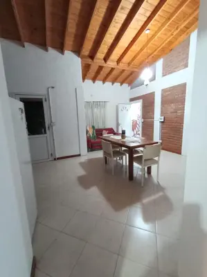 a dining room with a table and chairs in a room at Tierra Mia II in Carpintería