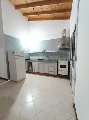 a kitchen with white appliances and a white tile floor at Tierra Mia II in Carpintería