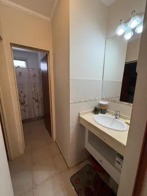 a bathroom with a sink and a mirror at Dpto Centrico Carlos Paz in Villa Carlos Paz